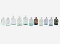 A collection of eleven mold-blown colored glass flasks, various makers, 19th century