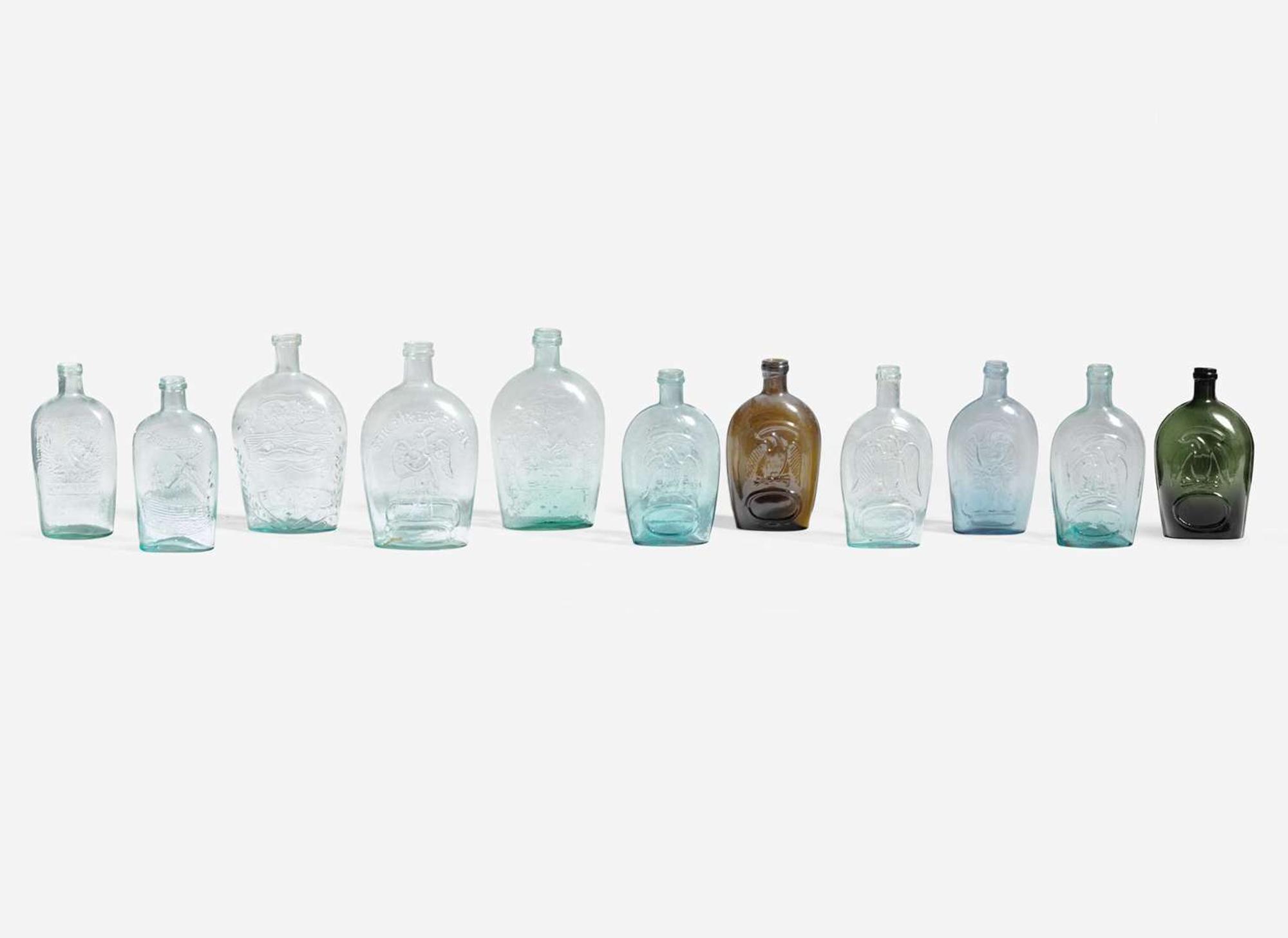 A collection of eleven mold-blown colored glass flasks, various makers, 19th century
