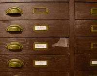 A Wooden File Cabinet 50" W x 29" D x 63" H — United States, 20th Century