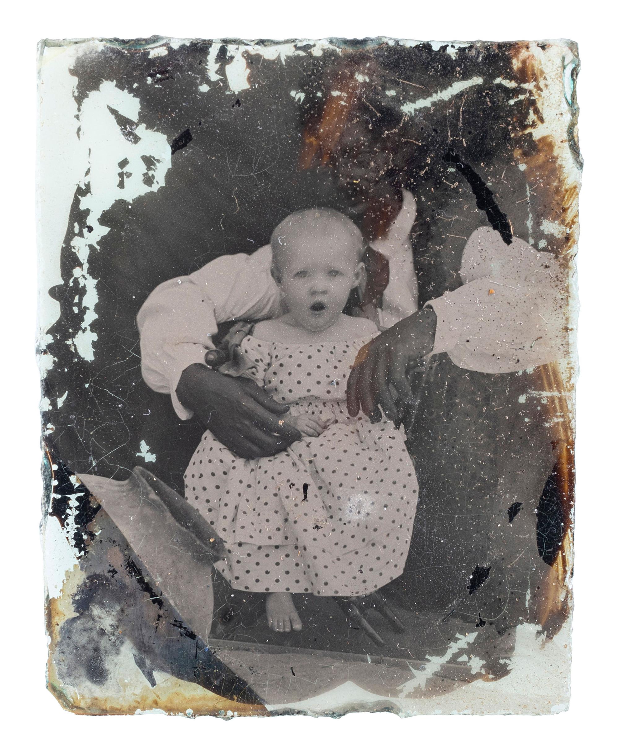 [EARLY PHOTOGRAPHY]. Ninth plate ambrotype of an African American man with white child, with rare Colonoware jar.