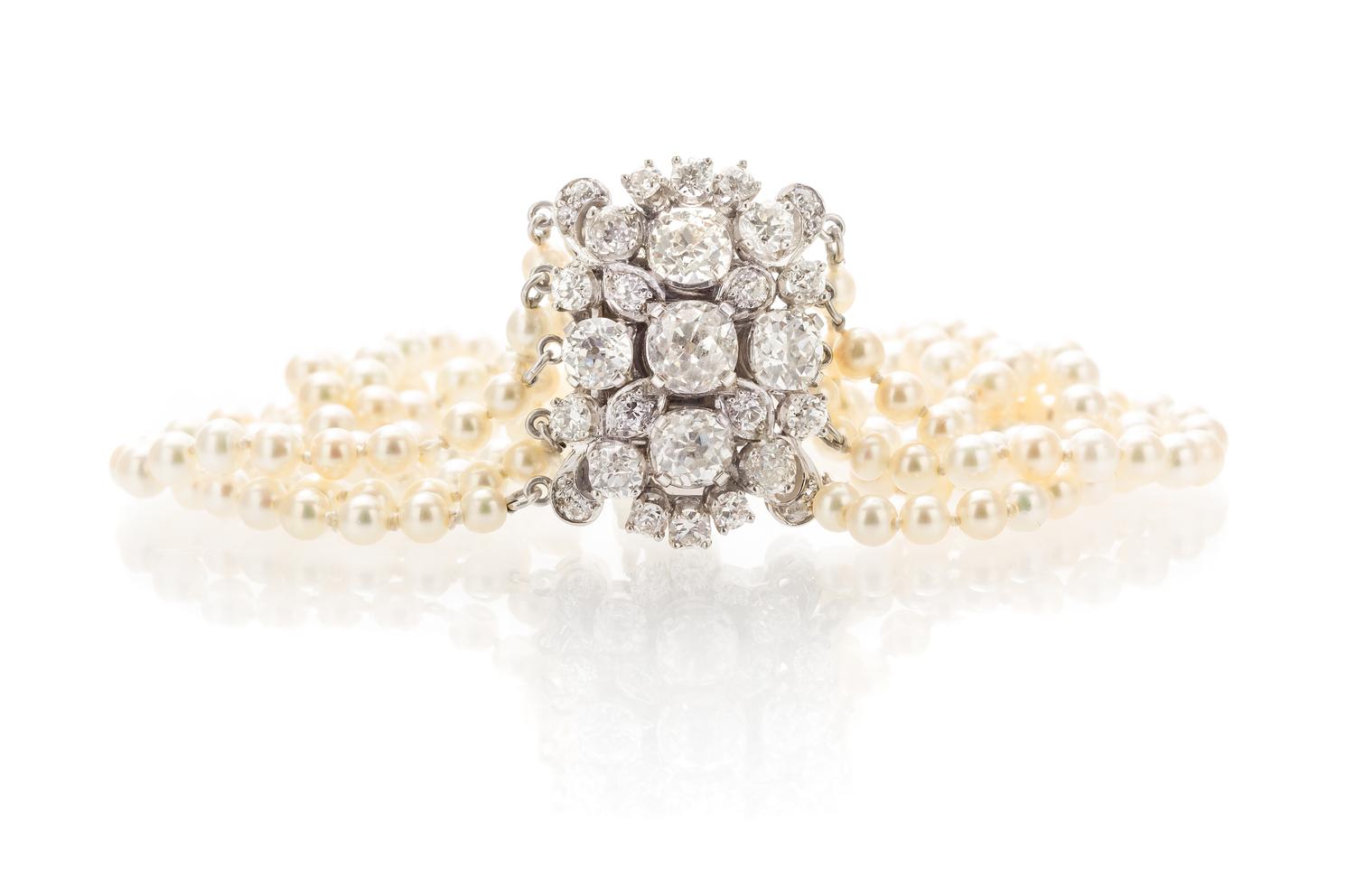 An Edwardian Platinum, Diamond and Pearl Multi Strand Bracelet, 17.50 dwts.