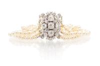 An Edwardian Platinum, Diamond and Pearl Multi Strand Bracelet, 17.50 dwts.