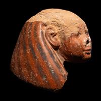 An Egyptian Polychrome Canopic Jar Lid