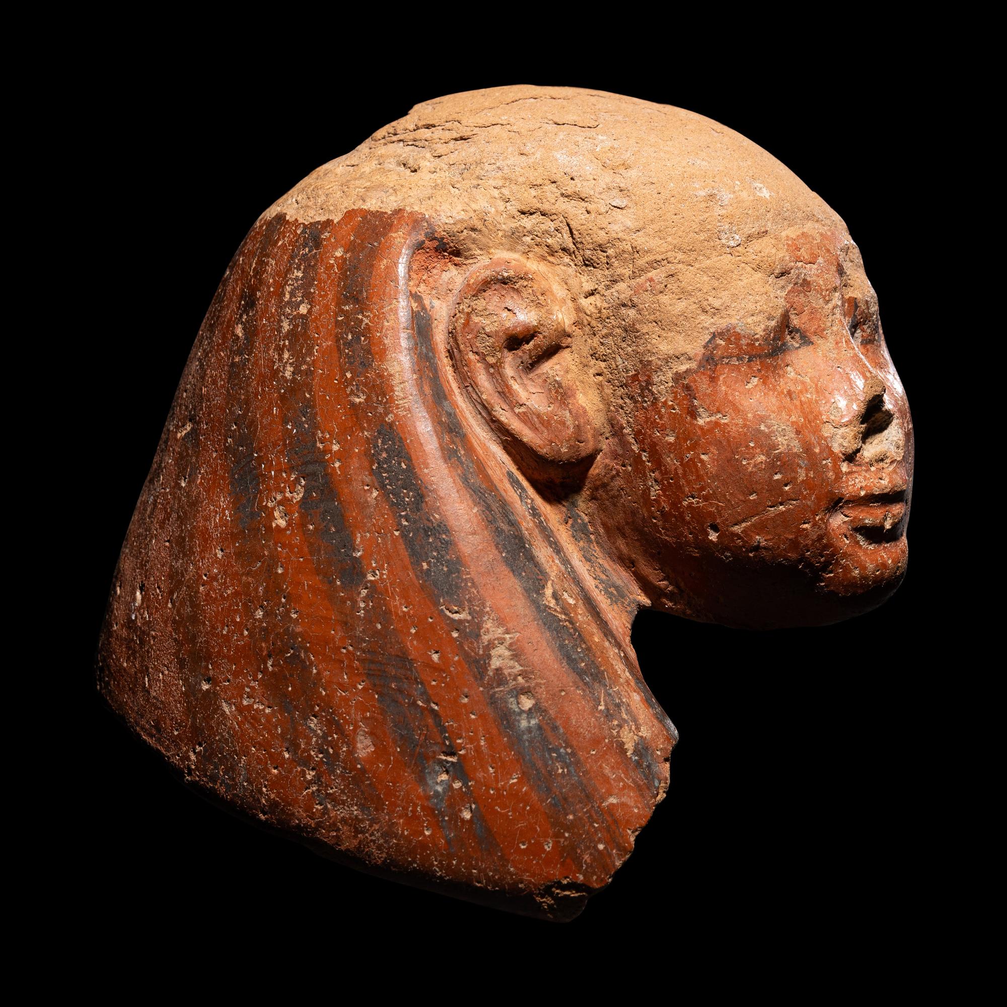 An Egyptian Polychrome Canopic Jar Lid