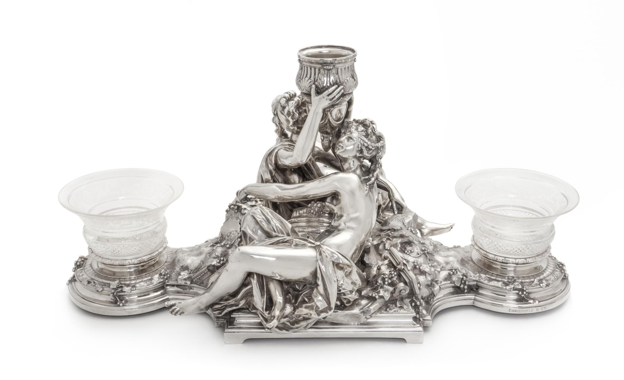 A French Silver-Plate Centerpiece, Christofle, Paris, 20th Century, the central cup supported by two embracing figures sitting on grape