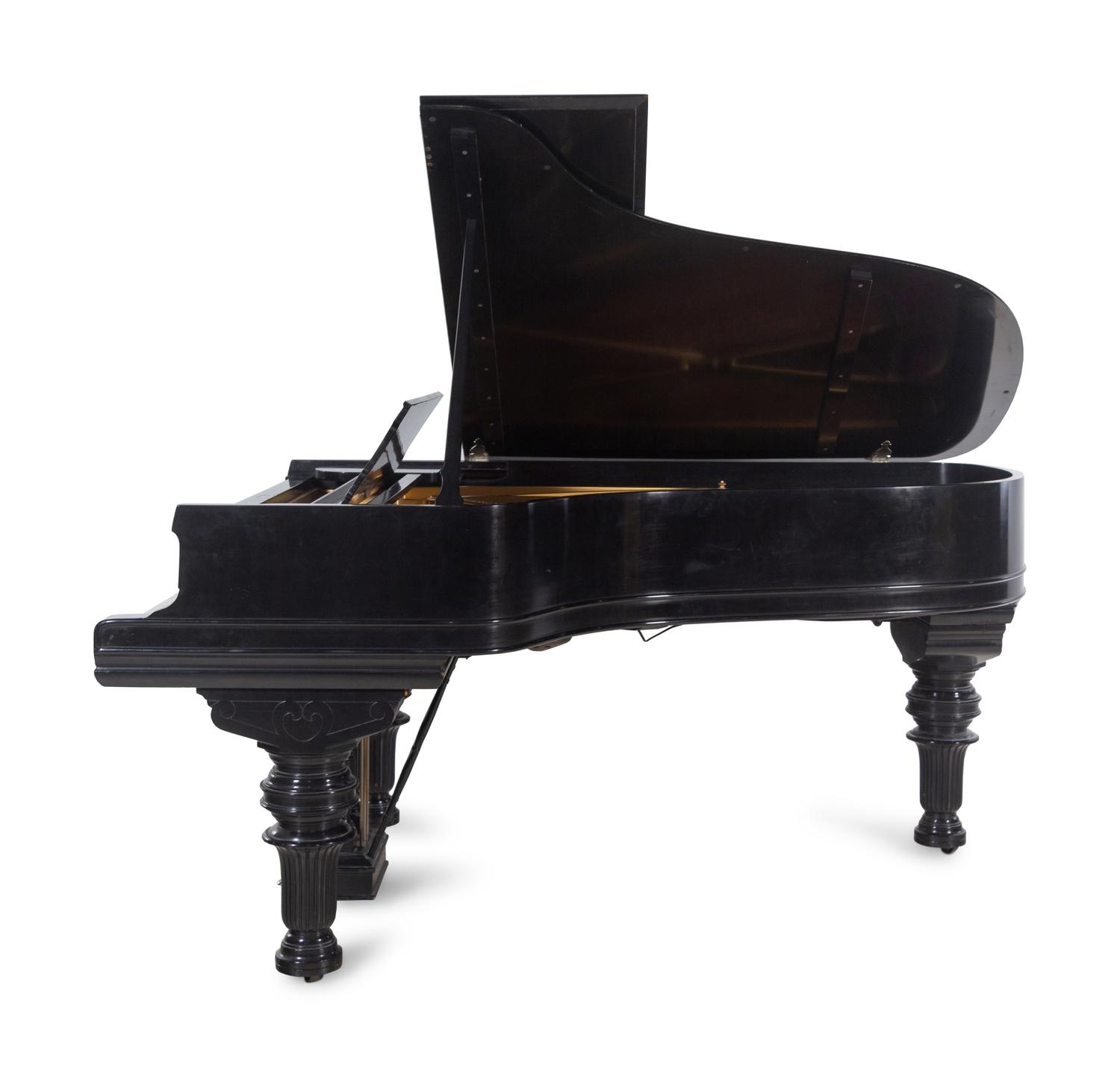 A Steinway and Sons Ebonized Concert Grand Piano