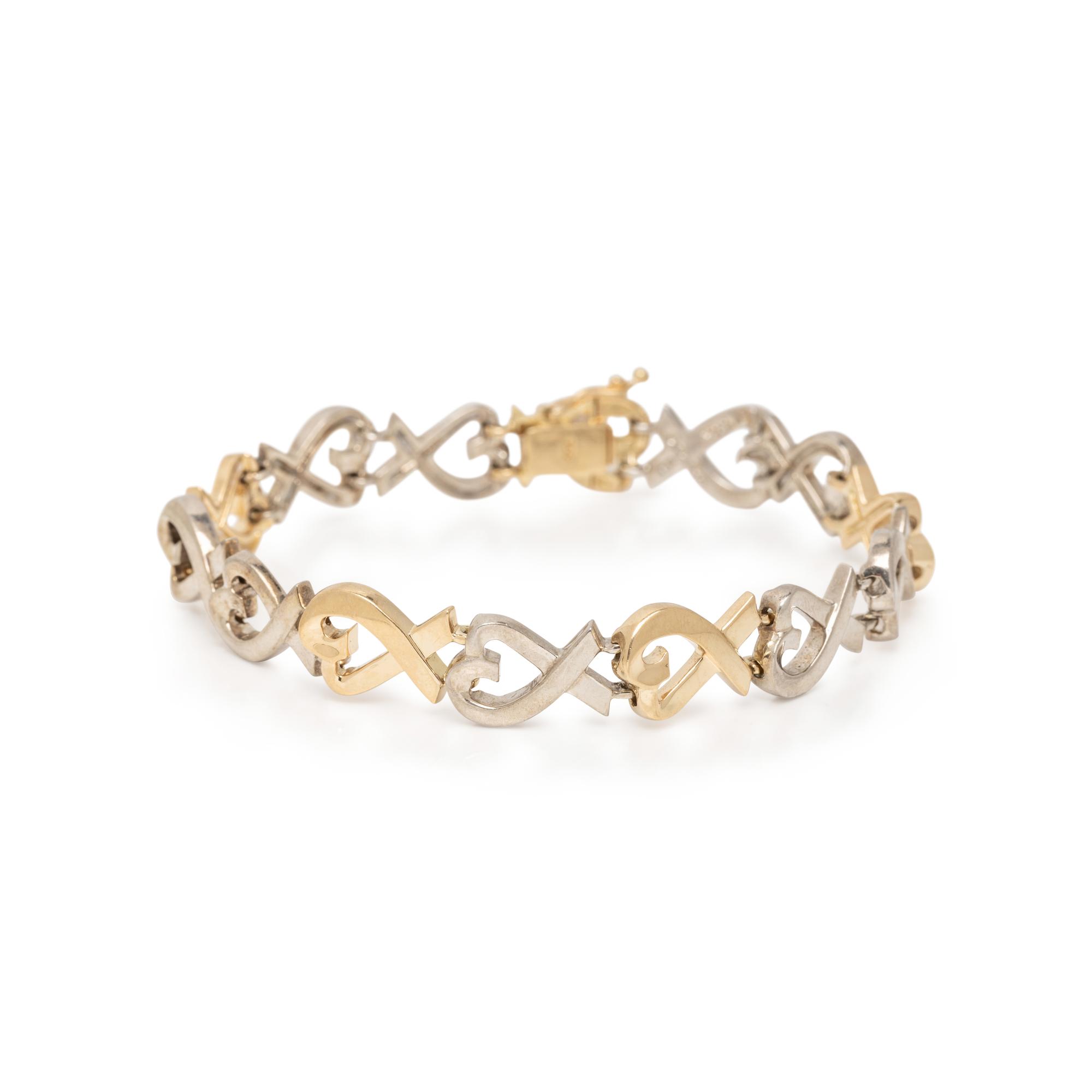 TIFFANY & CO., PALOMA PICASSO, STERLING SILVER AND YELLOW GOLD 'LOVING HEART' BRACELET
