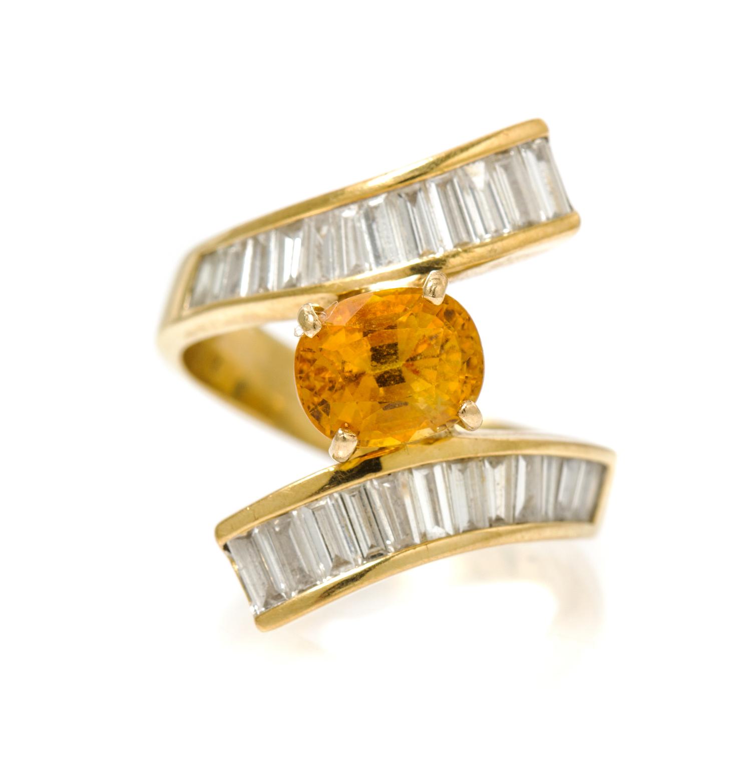 An 18 Karat Yellow Gold, Yellow Sapphire and Diamond Ring, 6.50 dwts.