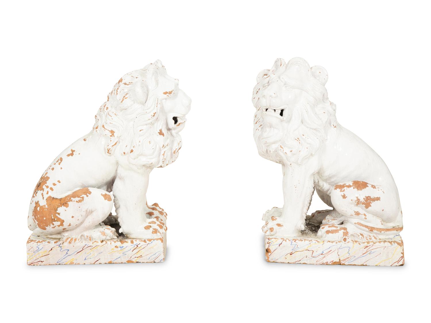 A Pair of Italian White Glazed Ceramic Seated Lions