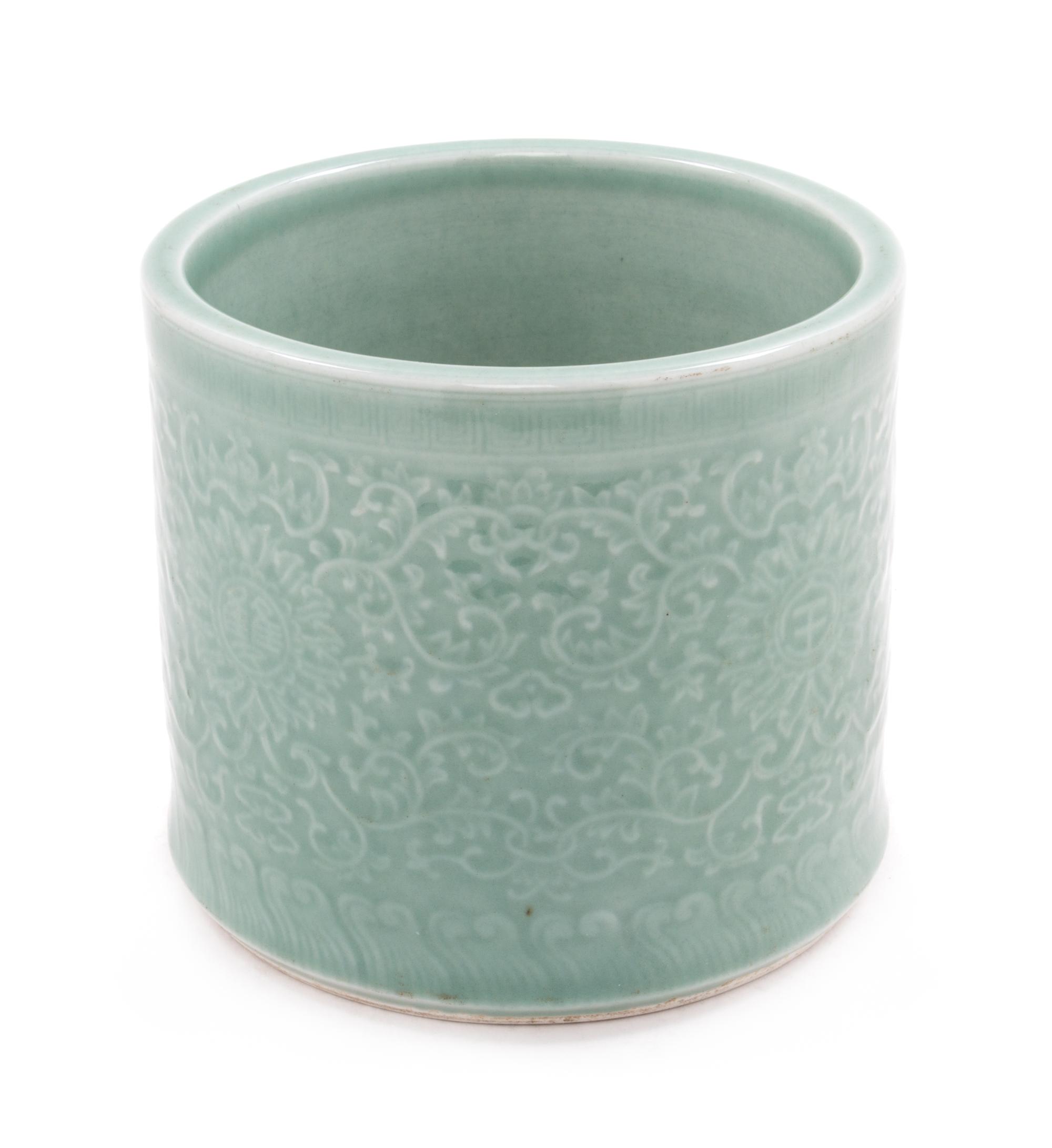 A Celadon Porcelain Brushpot Height 6 1/2 inches.
