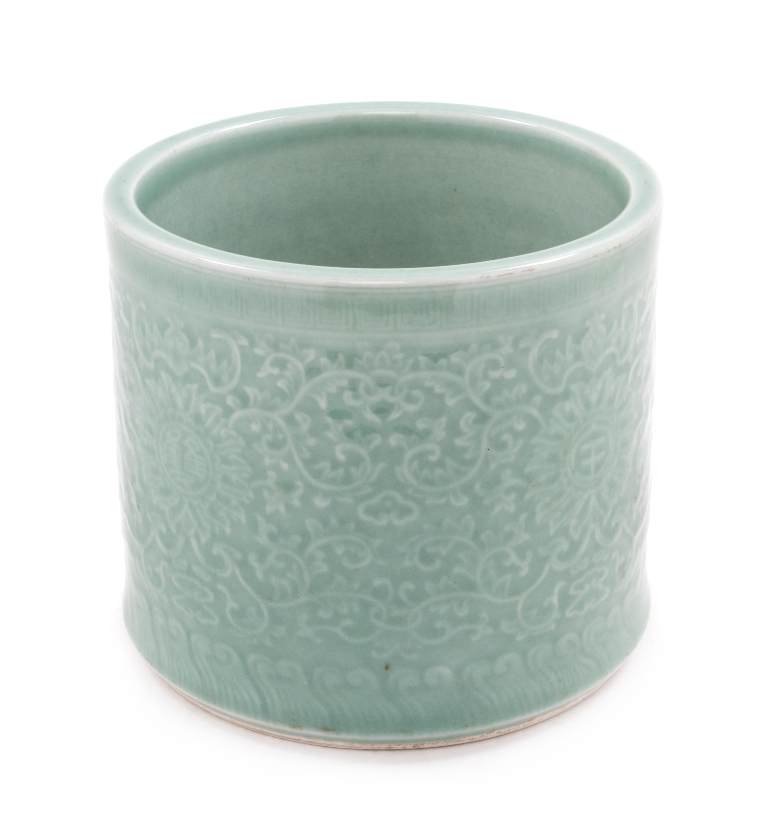 A Celadon Porcelain Brushpot Height 6 1/2 inches.