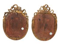 A Pair of Giltwood Framed Ebonized Relief Portrait Plaques of French Nobility, 18th Century