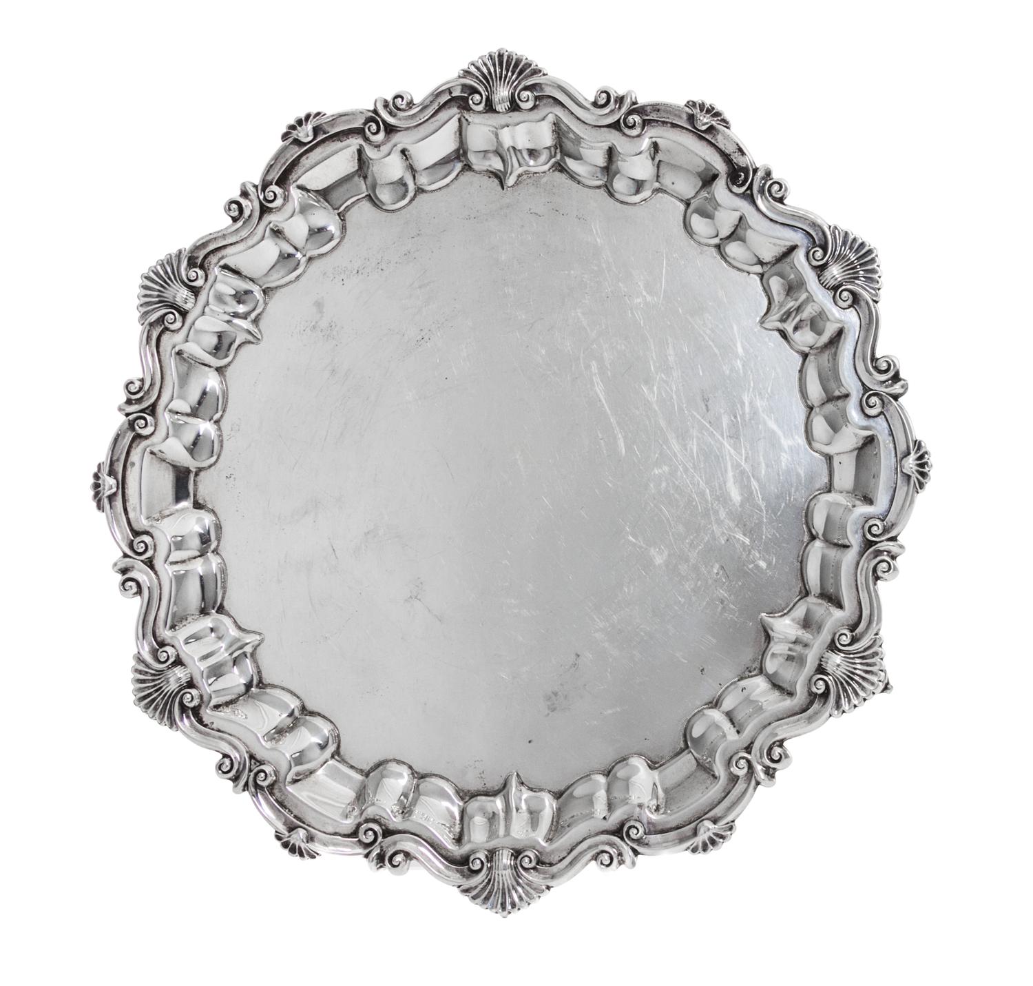 An Edwardian Silver Salver, Baker Brothers, Birmingham, 1901, in Georgian style, shaped circular with shell and scroll rim, raised on t