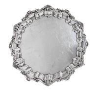 An Edwardian Silver Salver, Baker Brothers, Birmingham, 1901, in Georgian style, shaped circular with shell and scroll rim, raised on t