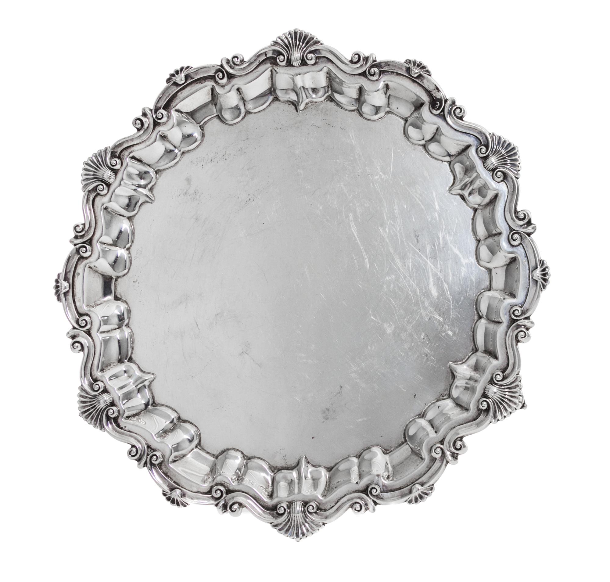An Edwardian Silver Salver, Baker Brothers, Birmingham, 1901, in Georgian style, shaped circular with shell and scroll rim, raised on t