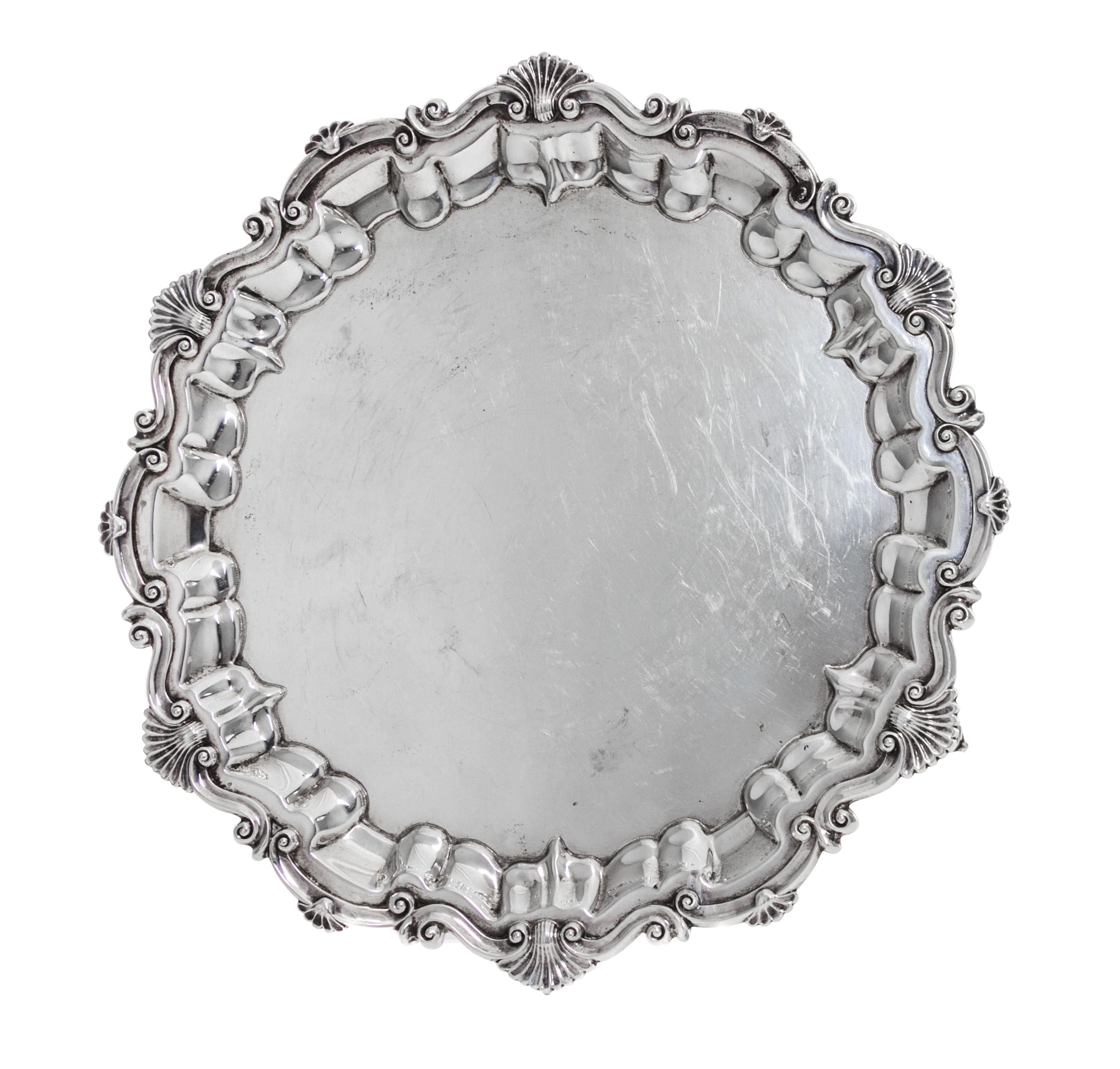 An Edwardian Silver Salver, Baker Brothers, Birmingham, 1901, in Georgian style, shaped circular with shell and scroll rim, raised on t