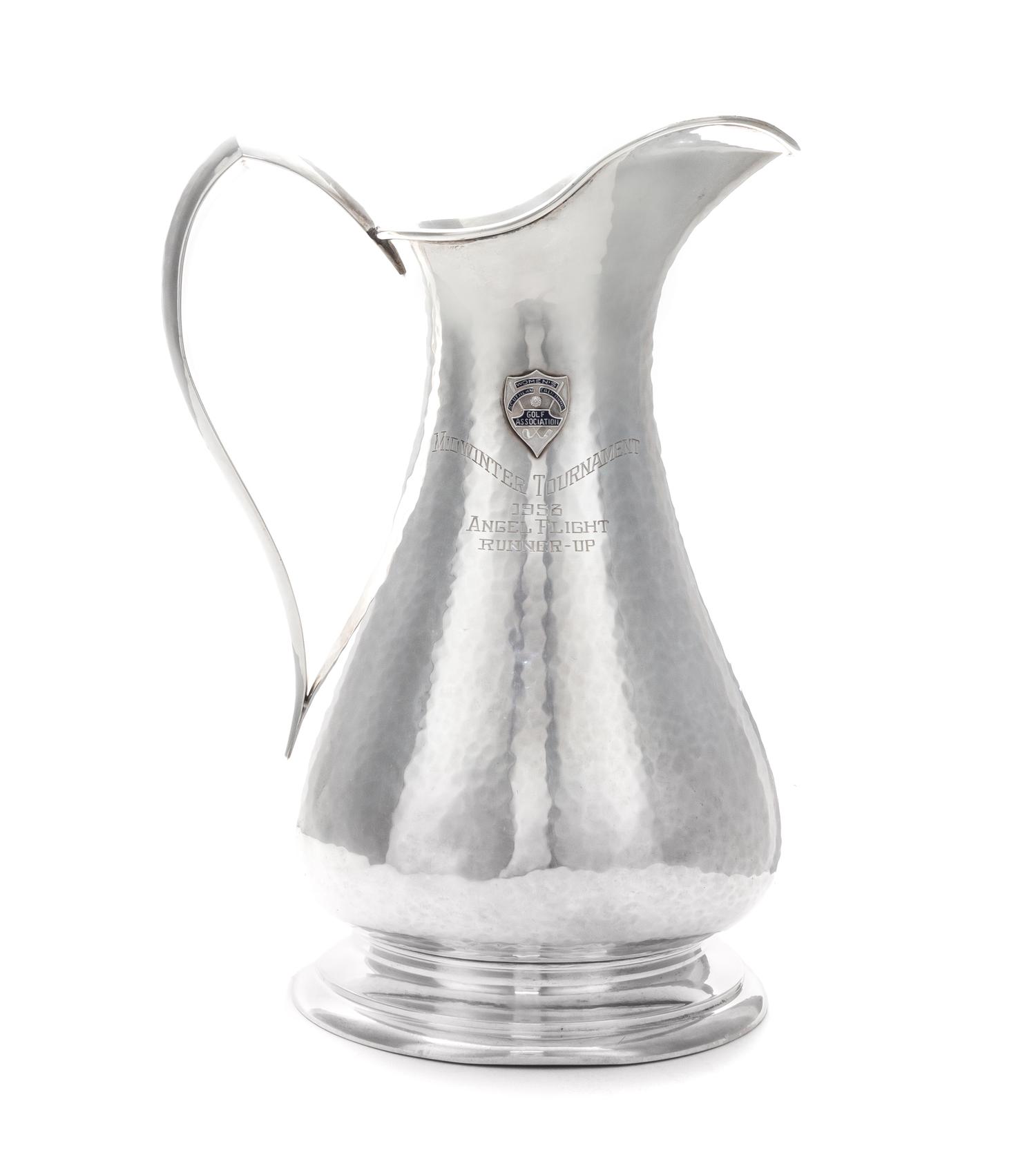 An American Silver Pitcher, Sedlacek & Co., Los Angeles, CA, 1945, of baluster form with a pointed loop handle, the spot-hammered surfa