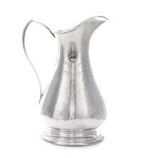 An American Silver Pitcher, Sedlacek & Co., Los Angeles, CA, 1945, of baluster form with a pointed loop handle, the spot-hammered surfa