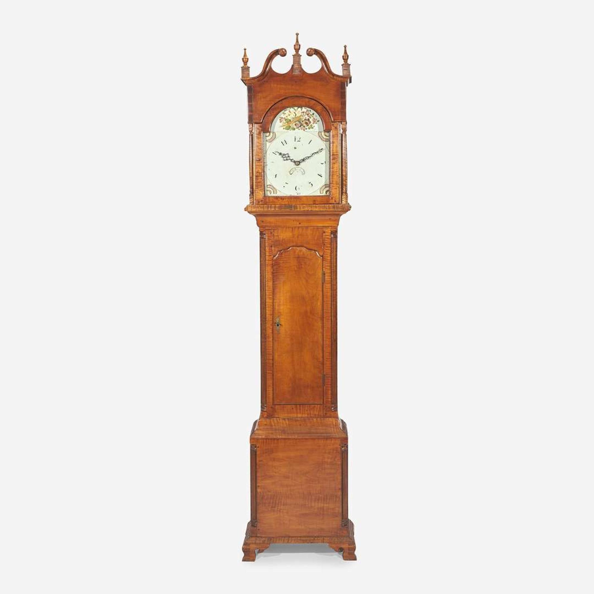 A Chippendale carved tiger maple tall case clock The face / works early 19th century, the case 20th century
