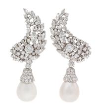 A Pair of Platinum, Diamond and Cultured Pearl Earclips, Seaman Schepps, 28.15 dwts.