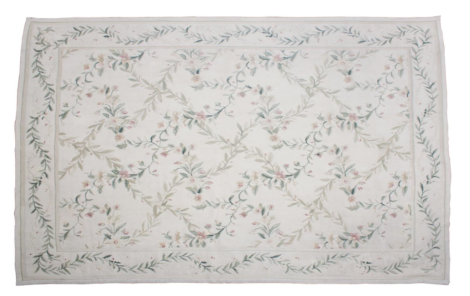 A Needlepoint Rug 5 feet 11 inches x 9 feet 2 inches. — (20TH CENTURY)