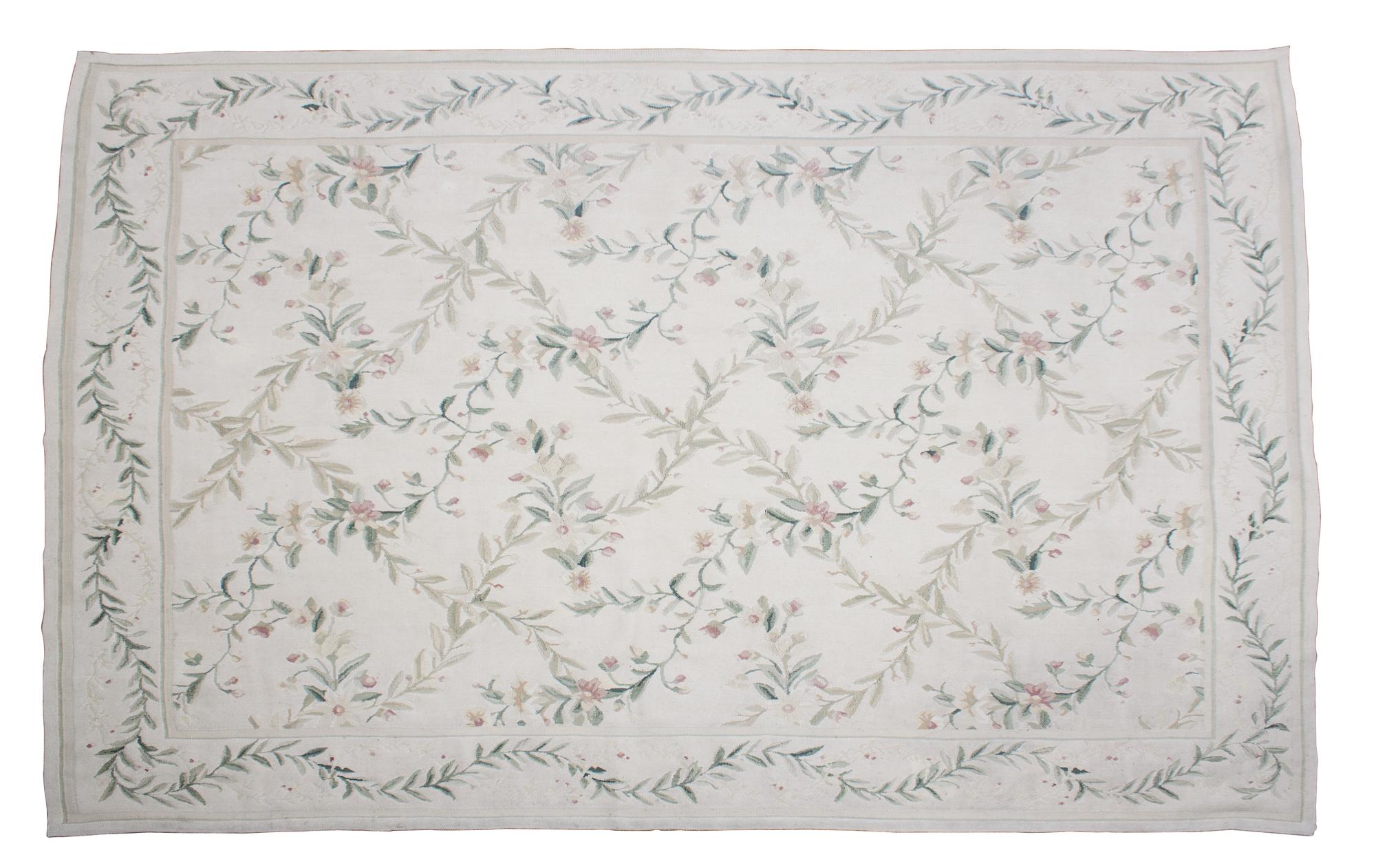 A Needlepoint Rug 5 feet 11 inches x 9 feet 2 inches. — (20TH CENTURY)