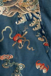 A Chinese Blue Ground Embroidered Silk Dragon Robe, Jifu