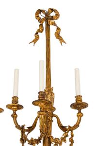A Set of Four Louis XVI Style Gilt Bonze Three-Light Sconces