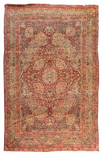 A Kirman Wool Rug 10 feet 2 inches x 6 feet 10 inches.