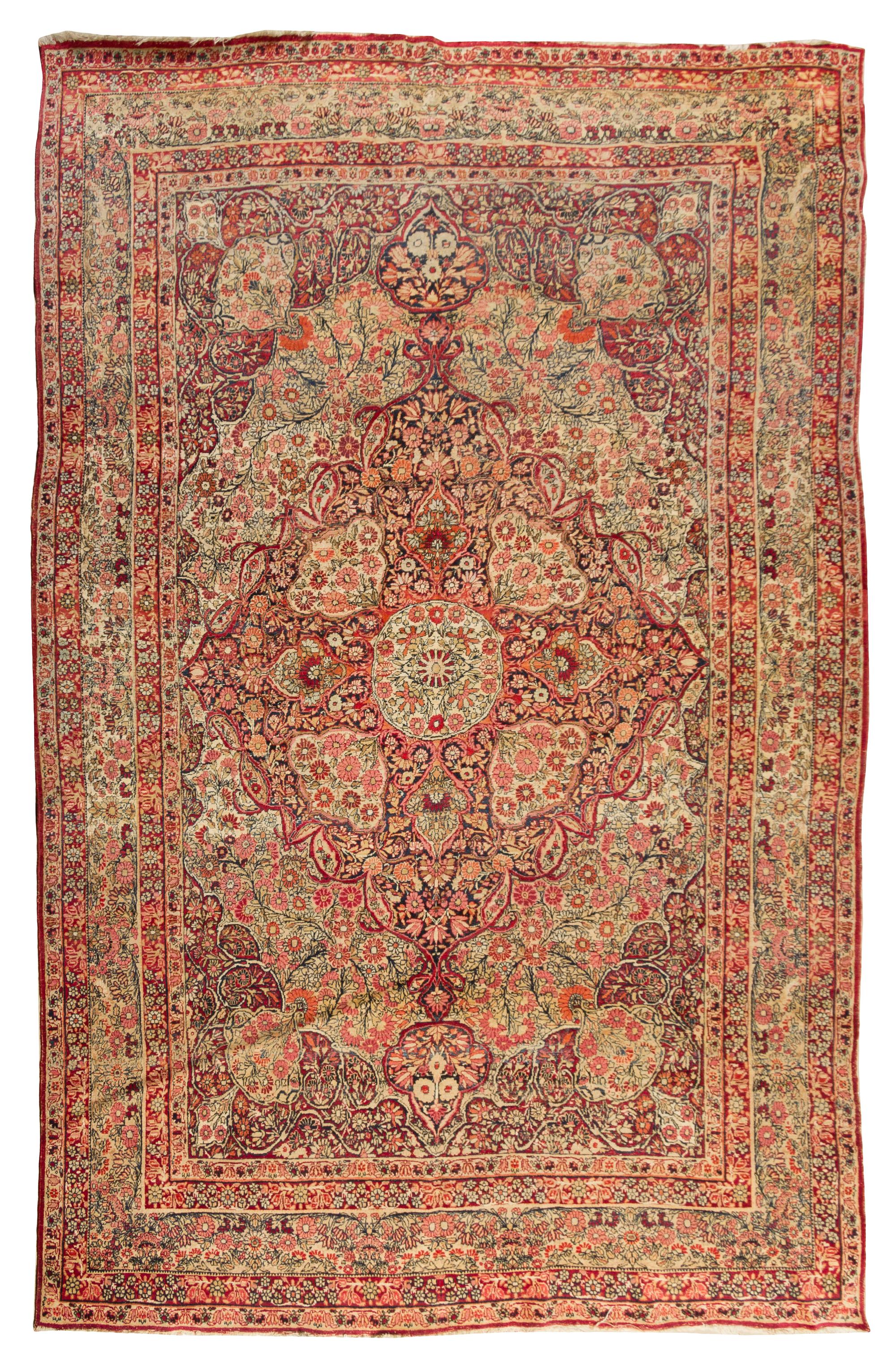 A Kirman Wool Rug 10 feet 2 inches x 6 feet 10 inches.