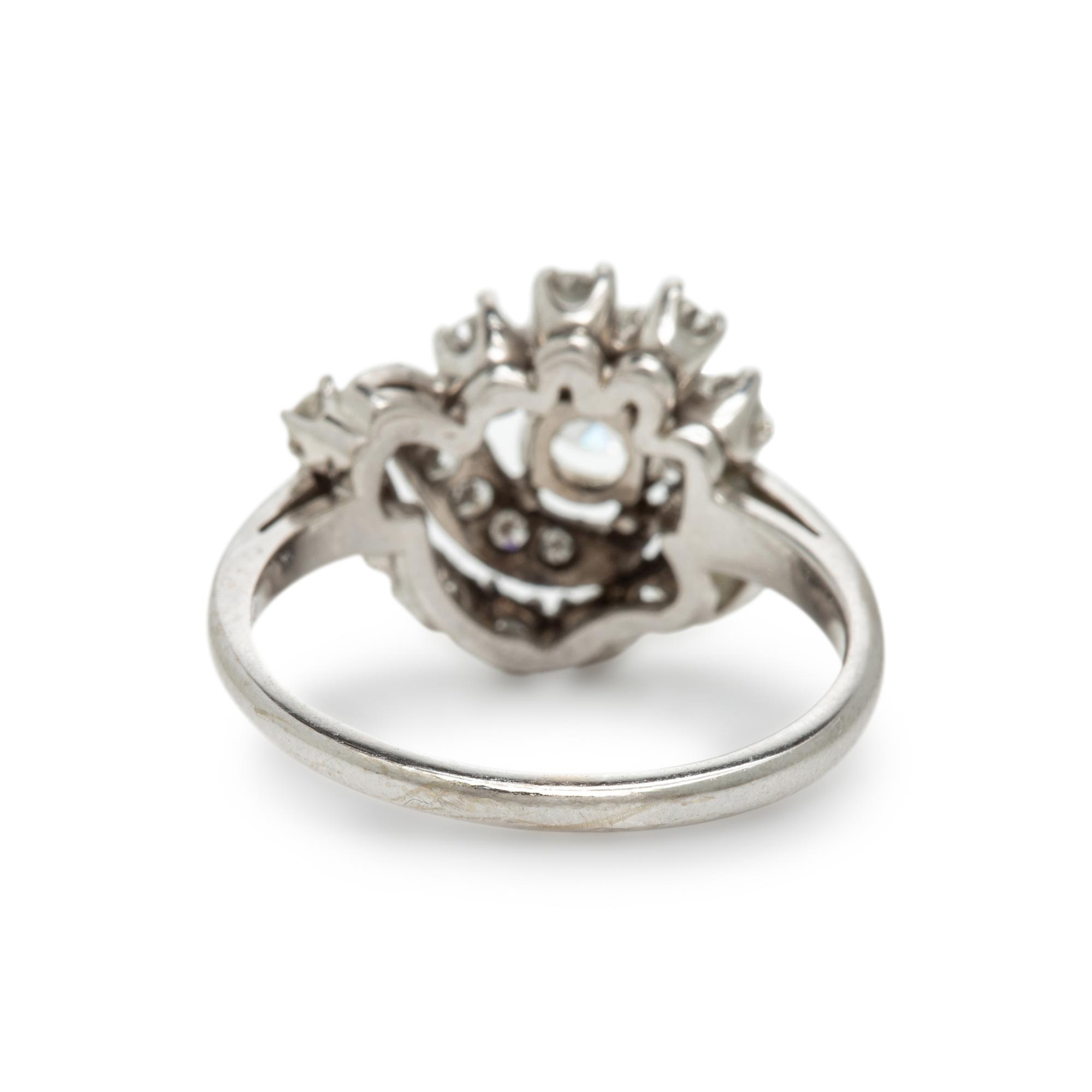 Diamond and White Gold Swirl Ring