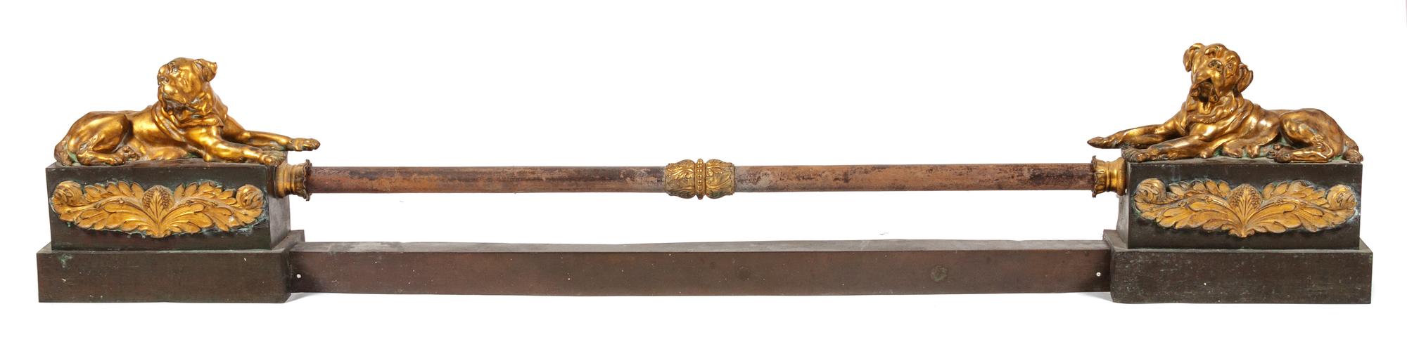 A Pair of Brass Mastiff Chenets Width 13 inches.