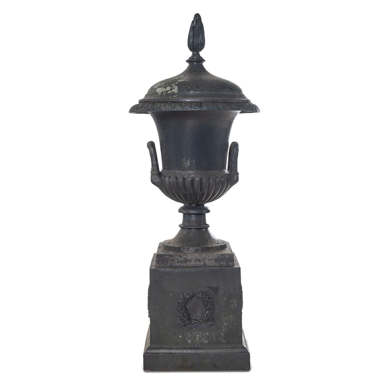 A Cast Iron Garden Urn and Pedestal