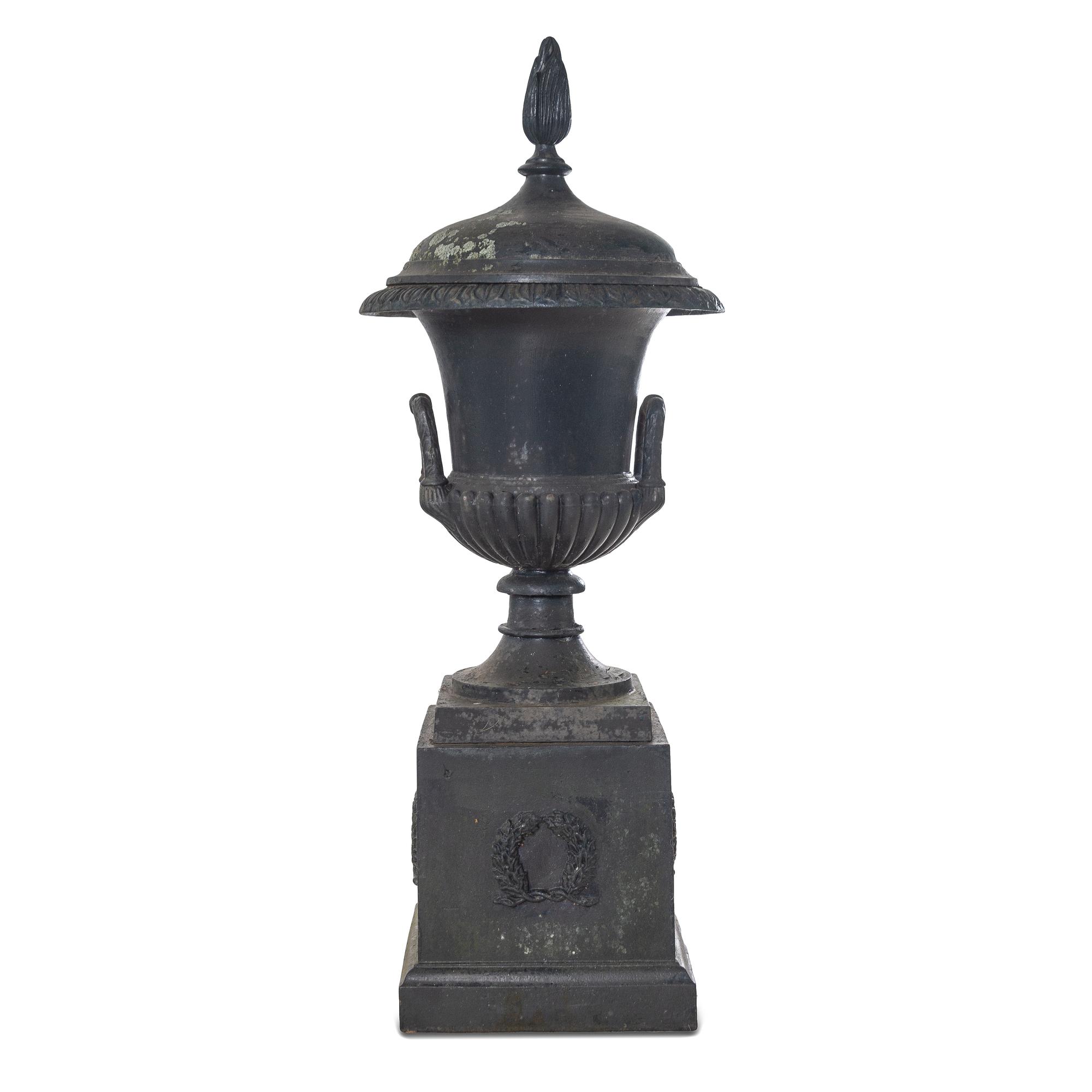 A Cast Iron Garden Urn and Pedestal
