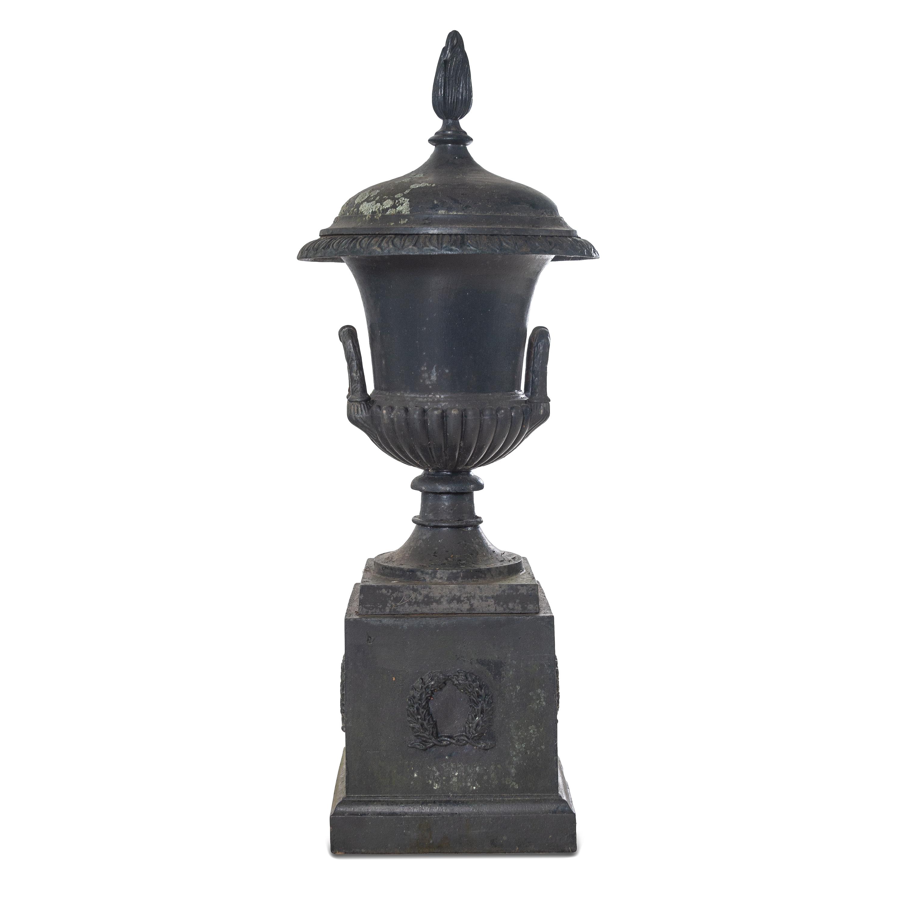 A Cast Iron Garden Urn and Pedestal