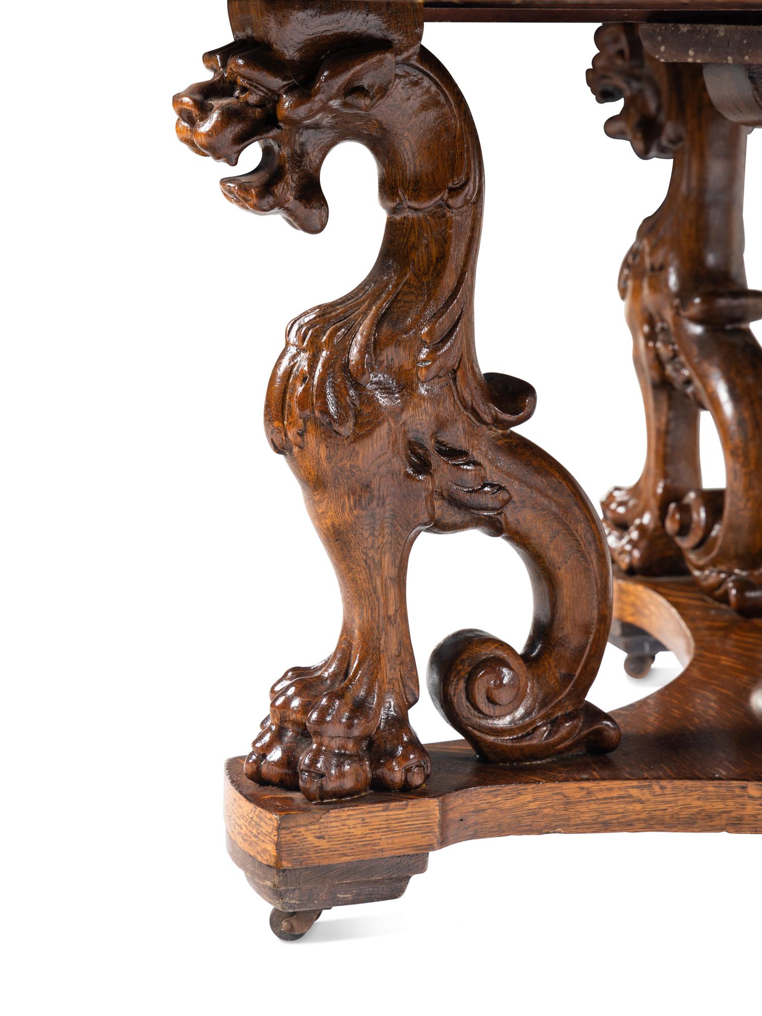 A Renaissance Revival Carved Oak Dining Table in the Manner of R. J. Horner