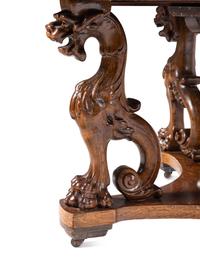 A Renaissance Revival Carved Oak Dining Table in the Manner of R. J. Horner