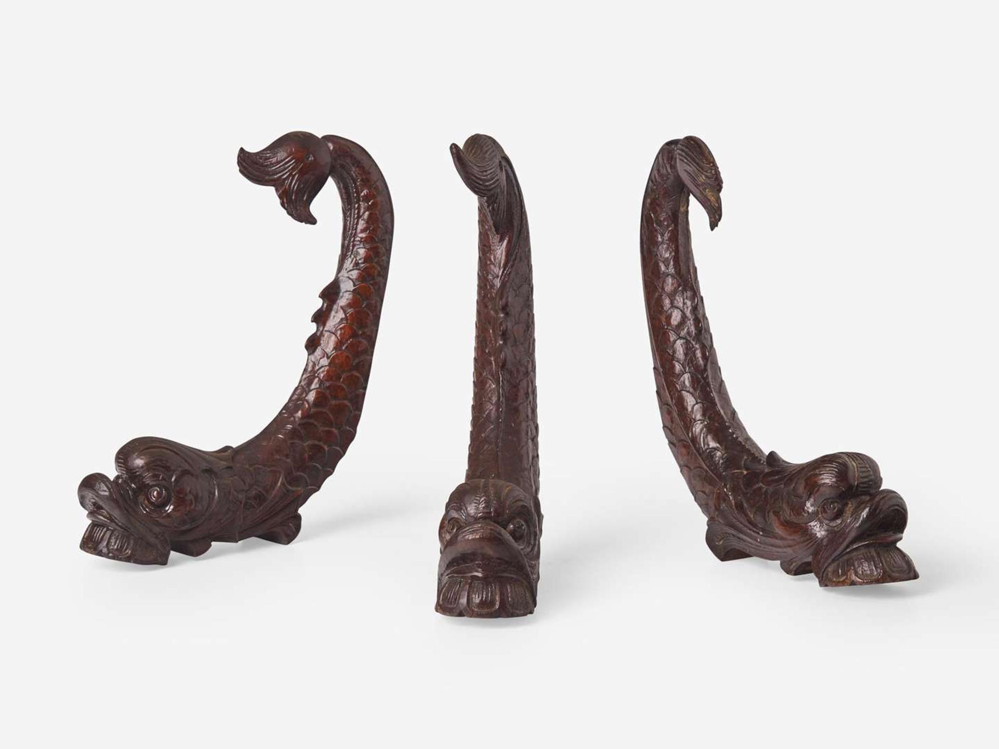 A group of three Classical carved mahogany dolphins, possibly Philadelphia, PA, circa 1820-1830