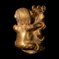A Tairona Tumbaga Mother and Child Figure