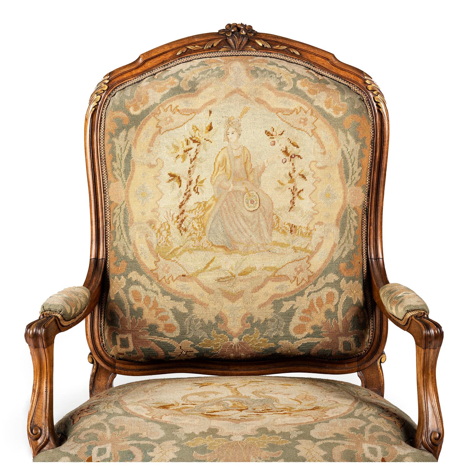 A Louis XV Style Carved Walnut and Needlework Upholstered Fauteuil