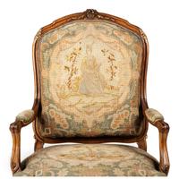 A Louis XV Style Carved Walnut and Needlework Upholstered Fauteuil