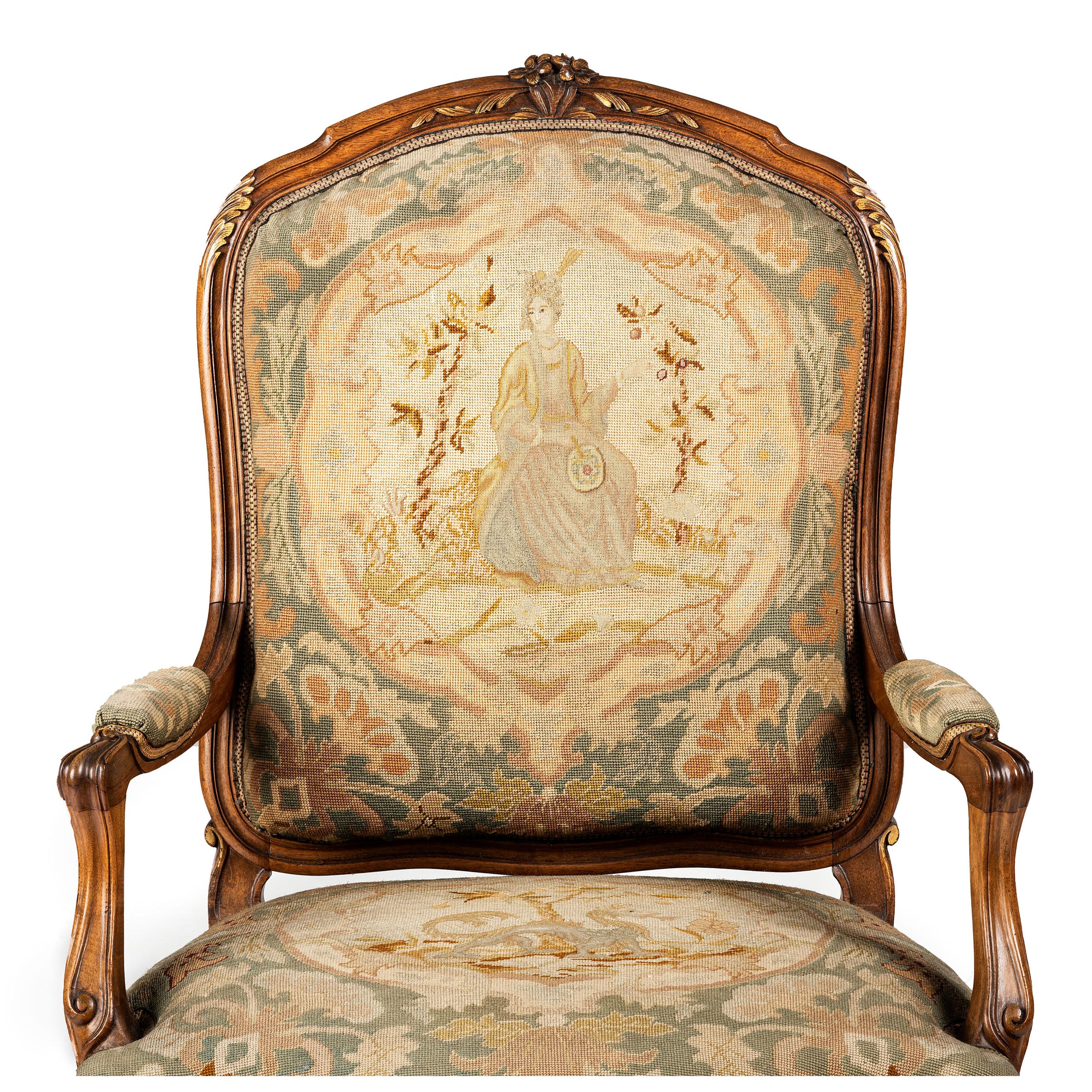 A Louis XV Style Carved Walnut and Needlework Upholstered Fauteuil