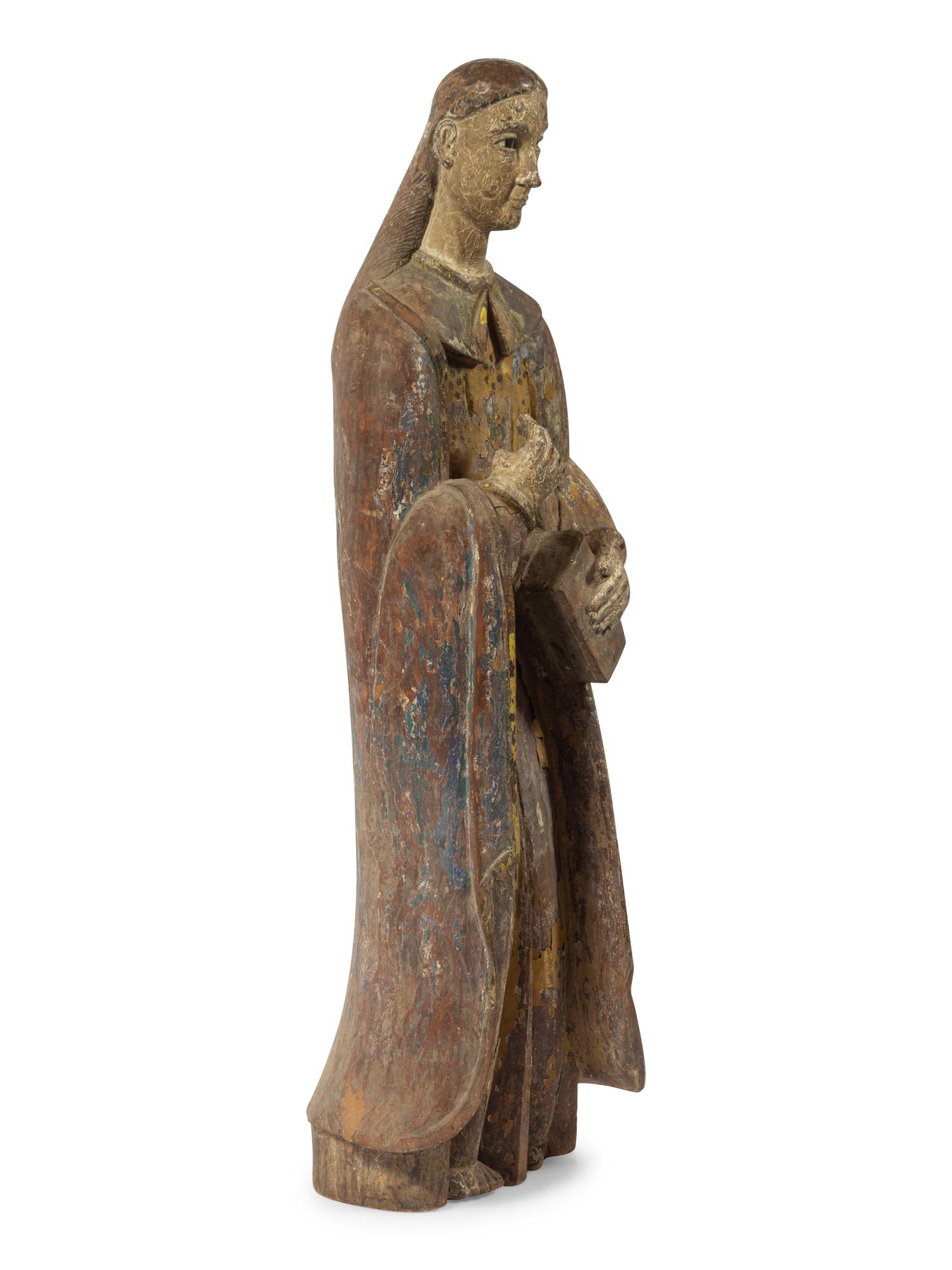 A Carved and Painted Figure of a Saint