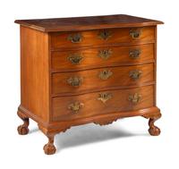 A Chippendale Carved And Figured Mahogany Serpentine Chest Of Drawers