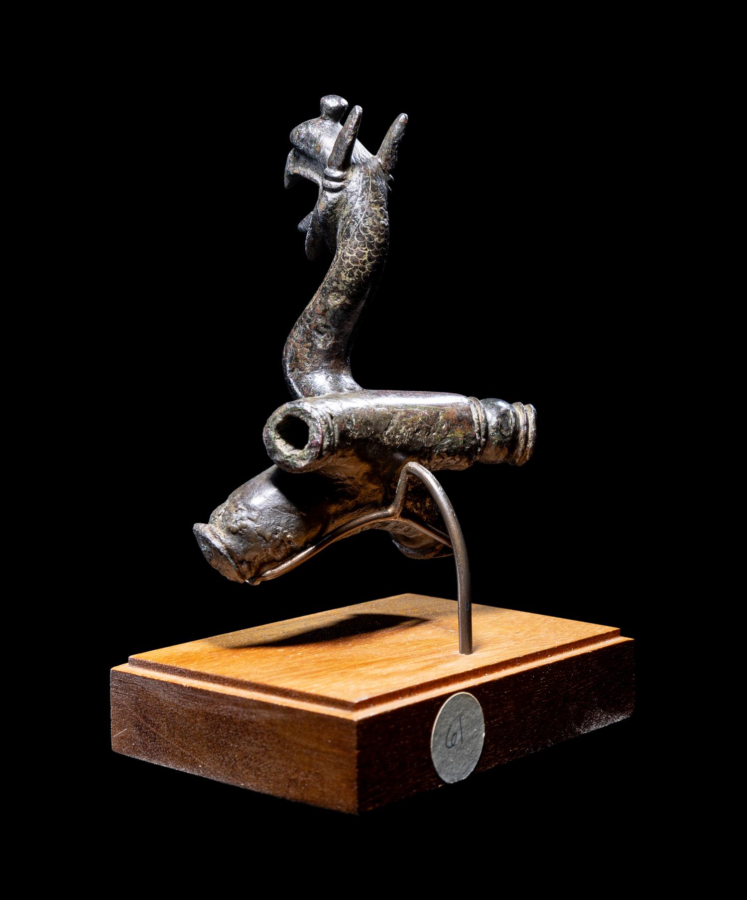 An East Greek Bronze Griffin Protome