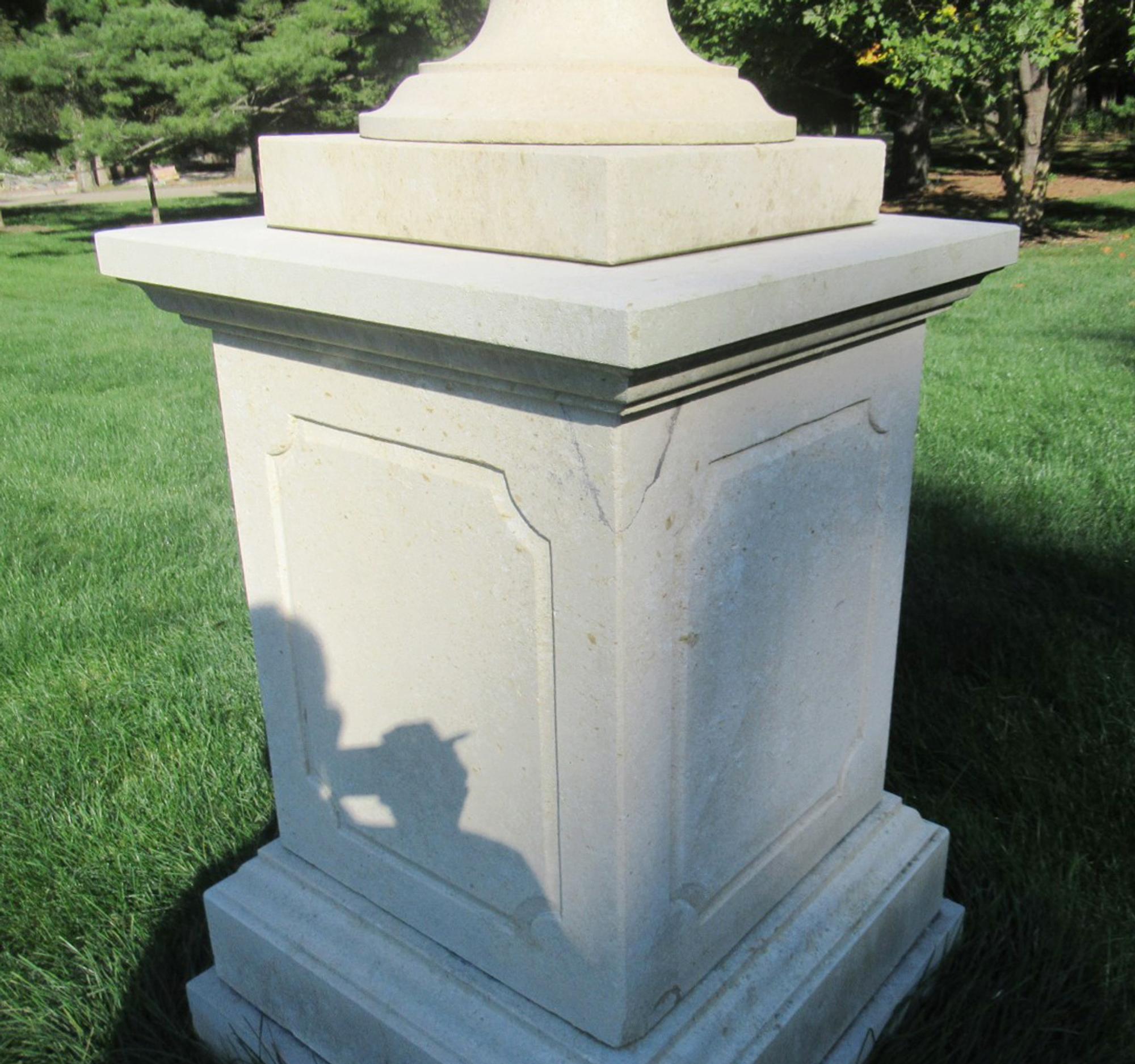 A Pair of Large Limestone Lidded Urns
