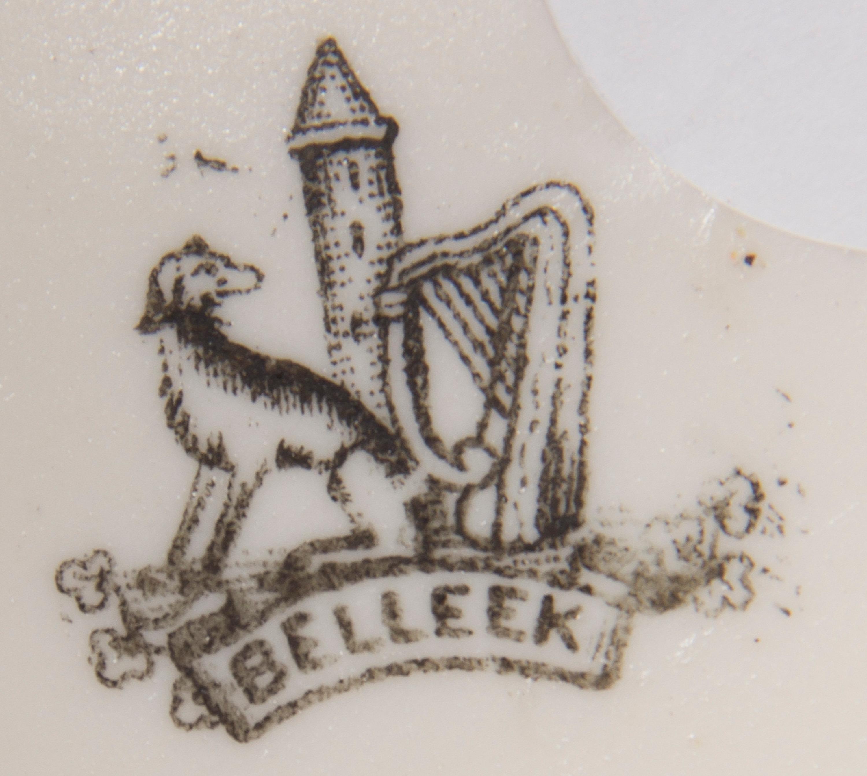 A Belleek Affection Figure, Height 14 1/2 inches.