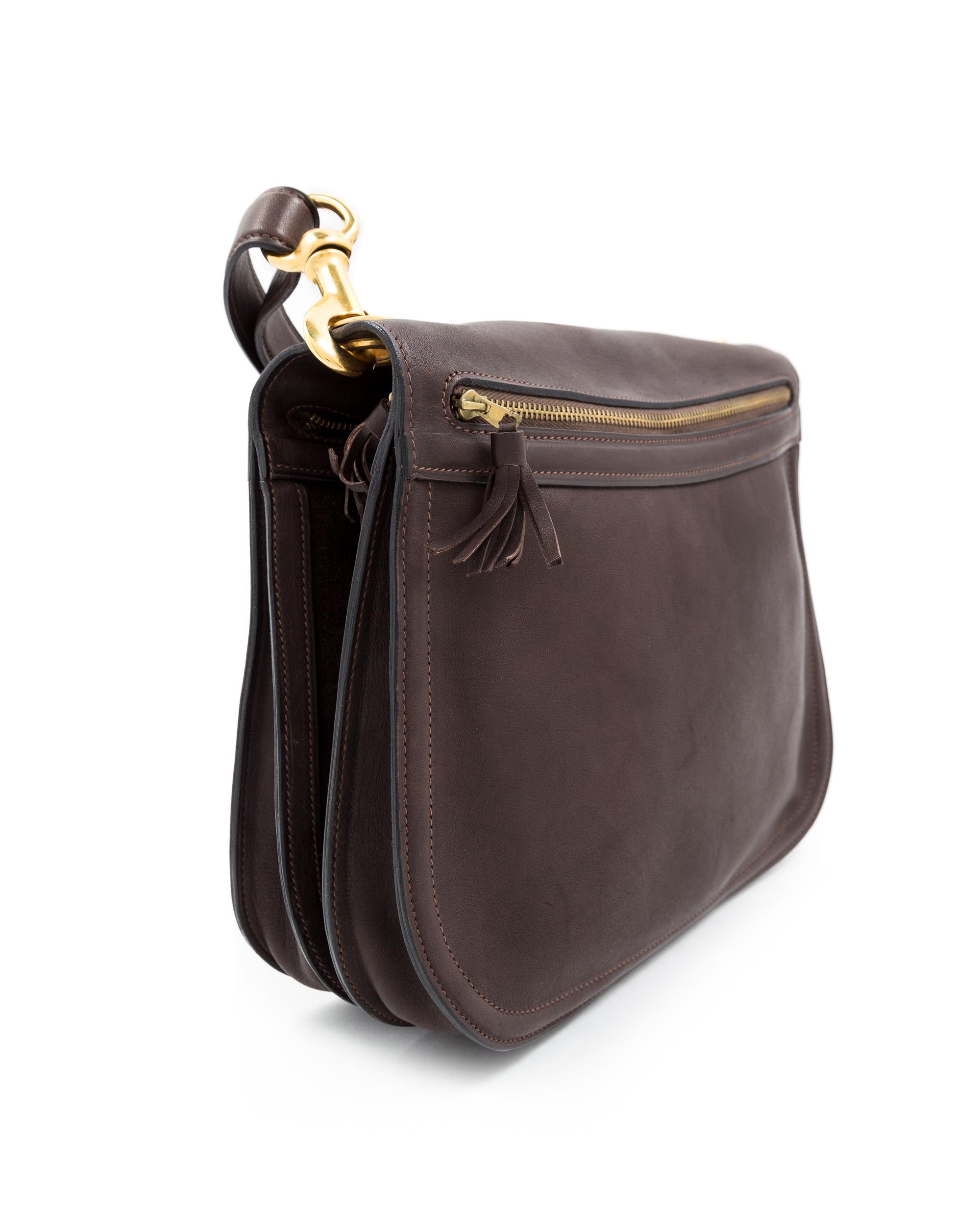 A Gucci Brown Leather Vintage Reversible Saddle Shoulder Bag, 9.75" H x 10.75" W x 2" D; Strap drop: 8.5"- 9".