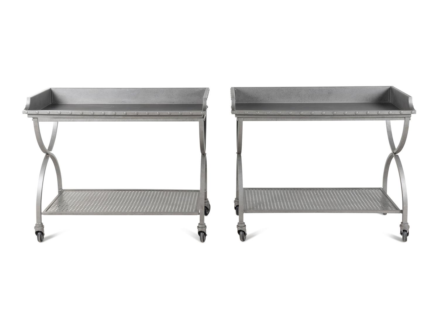 A Pair of Patinated Metal Two-Tier Serving Carts