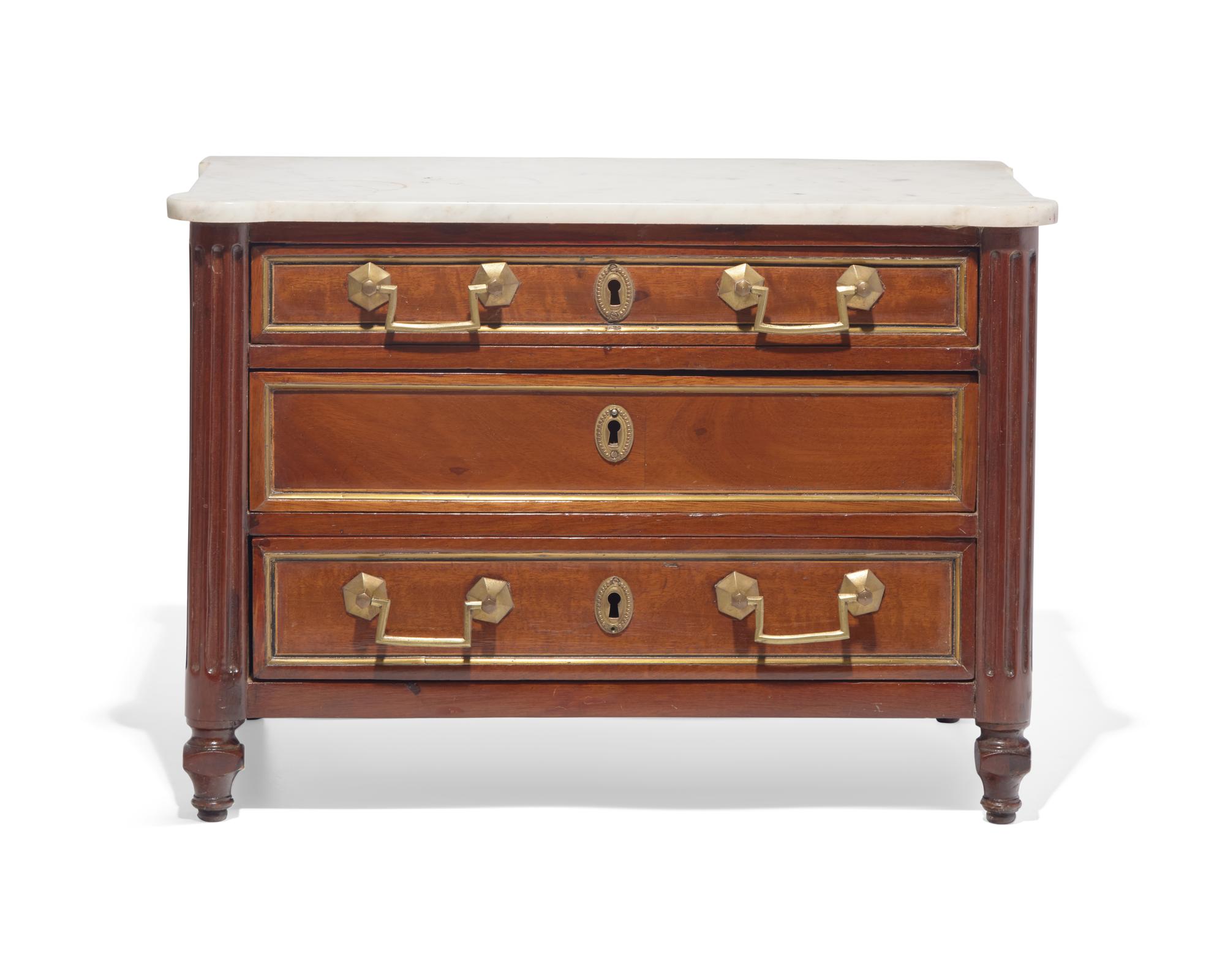 A miniature Directoire inlaid and brass-mounted mahogany commode with white marble top, circa 1800